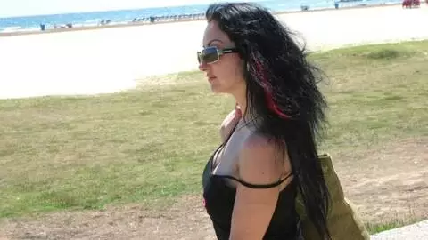 Pornstar brunette with big tits Ana Martin doing a strip by the sea  photo 1