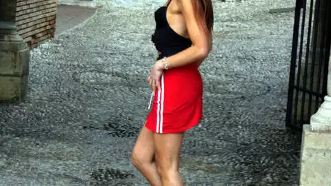 Pretty brunette Angelina doing a hot striptease 