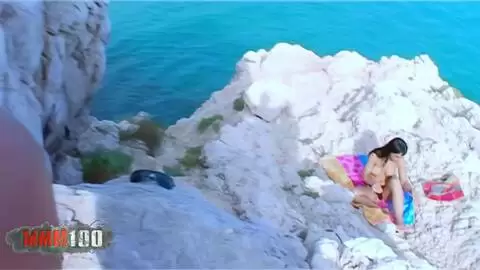 Busty brunette fucked in the ass on the rocks