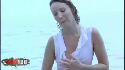 French beauty Ava Blue strips at the beach photo 11