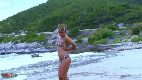 Hot young blonde Baby Reed doing a strip on the beach 