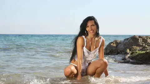 MILF arab brunette Bettina Kox stripping on the beach 