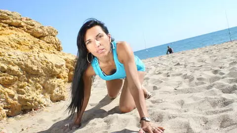 Hot mature arab brunette Bettina Kox dancing and stripping in the rocks 