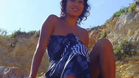 Nice little oriental Betty stripping by the sea  photo 01