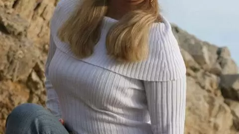 Pornostar young blonde with big boobs Calia B doing a strip by the sea  photo 3