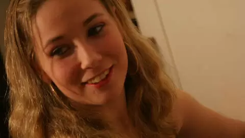 Lovely petite blonde with big boobs Calia B doing a hot striptease on the sofa  photo 1