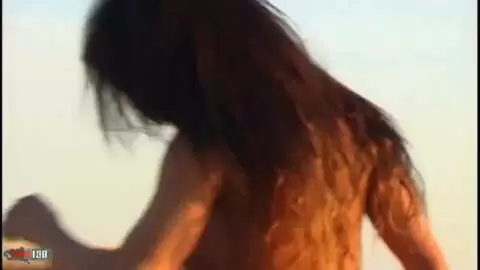 Pretty with big tits Christine doing a strip on the beach  photo 10