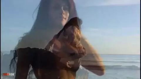 Pretty with big tits Christine doing a strip on the beach 