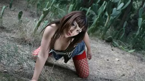 MILF Dalila Ray removing clothes in the woods 