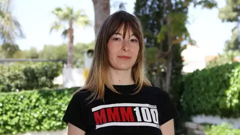 Denise Ahlm poses for pictures with the MMM100 tshirt photo 4