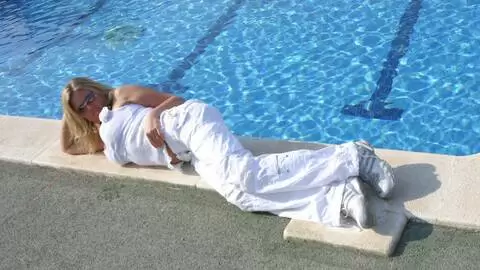 Great blonde with big tits Electra removing clothes at the pool  photo 4