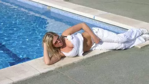 Great blonde with big tits Electra removing clothes at the pool  photo 6