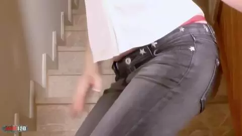 Pretty young brunette Emy dancing and stripping in the stairs 