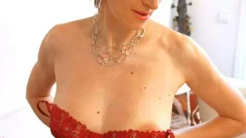 Nice MILF blonde Estelle Clark getting naked on the sofa  photo 8