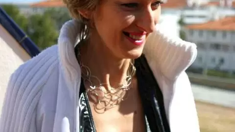 Horny milf blonde Estelle Clark doing a strip on the terrace 