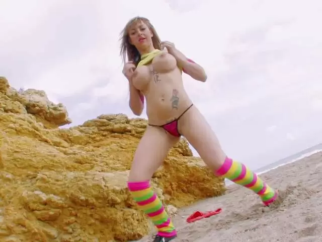 Pornstar blonde with big boobs Eva Lange stripping on the beach  photo 1