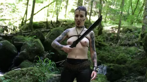 The beautiful French brunette Irogenia does a striptease in a warrior outfit photo 6