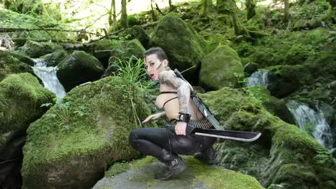 The beautiful French brunette Irogenia does a striptease in a warrior outfit photo 7