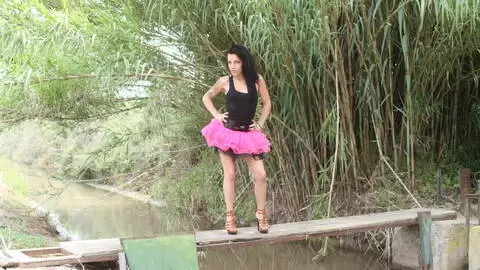 Pornstar little brunette Jordanne Kali getting naked by the river  photo 1