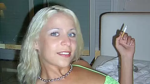 Slutty blonde babe strips and smokes on the sofa photo 13