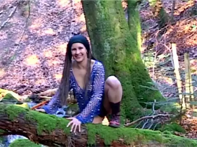 Hot petite brunette Katia stripping in the woods  photo 2