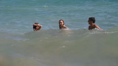 Pornstar little redhead Lola Bella removing clothes by the sea  photo 1