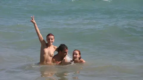 Pornstar little redhead Lola Bella removing clothes by the sea  photo 3