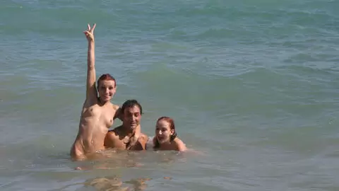 Pornstar little redhead Lola Bella removing clothes by the sea  photo 4