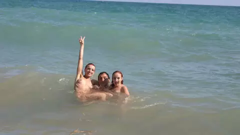 Pornstar little redhead Lola Bella removing clothes by the sea  photo 6