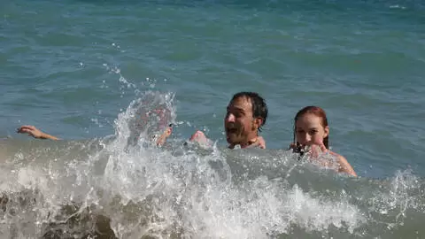 Pornstar little redhead Lola Bella removing clothes by the sea  photo 12