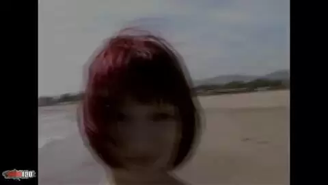 Lovely redhead Mahylis doing a strip on the beach  photo 16