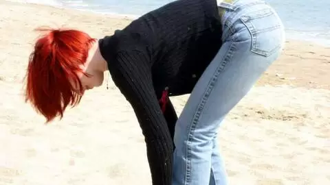 Pretty redhead Mahylis stripping on the beach  photo 1