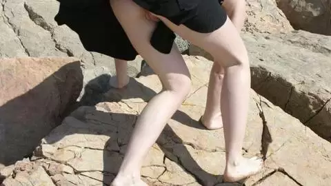 Small tits babe making hot strip on the rocks photo 13