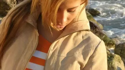 Pretty petite blonde Marta doing a hot striptease by the sea  photo 2