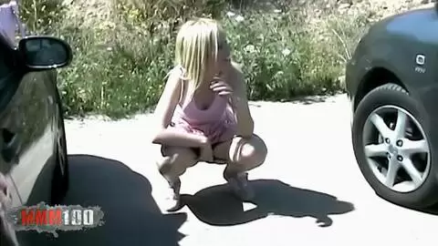 Young French blonde Melissa pees in a parking lot photo 01