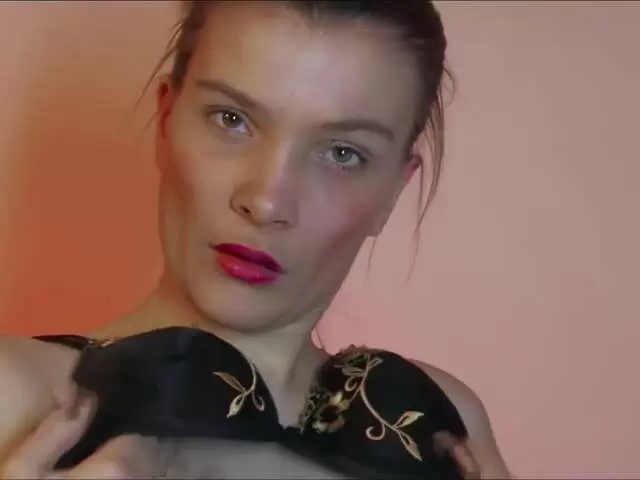 Pretty brunette Millie Espiegle doing a hot striptease on the sofa  photo 1