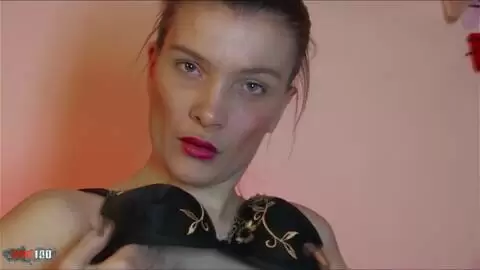 Pretty brunette Millie Espiegle doing a hot striptease on the sofa 