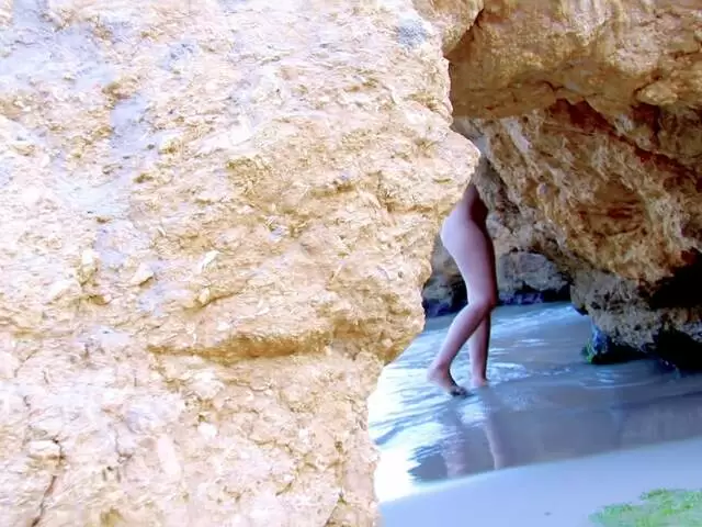 Lovely little brunette Nathalie Sainlouis doing a hot striptease on the beach  photo 3