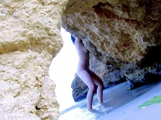 Lovely little brunette Nathalie Sainlouis doing a hot striptease on the beach  photo 4