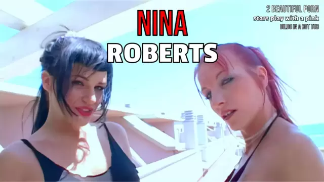 2 beautiful porn stars play with a pink dildo in a hot tub