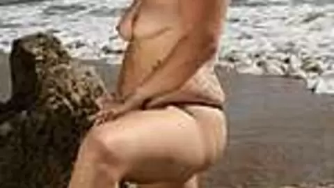 La plump Rose Kisu doing a hot striptease on the beach  photo 15