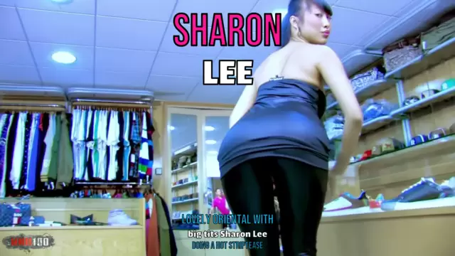 Lovely oriental with big tits Sharon Lee doing a hot striptease 