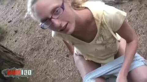 Starla Candy takes a pee break in the woods