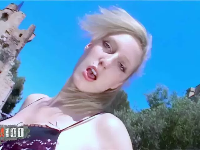 The beautiful French blonde Starla Candy does a strip tease in front of a stunning castle photo 1