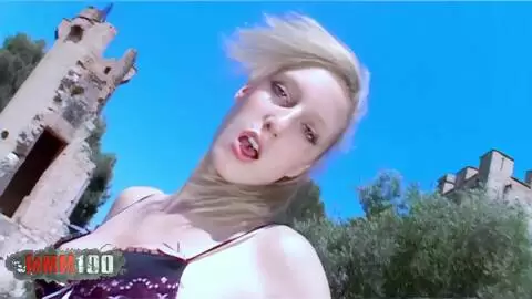 The beautiful French blonde Starla Candy does a strip tease in front of a stunning castle