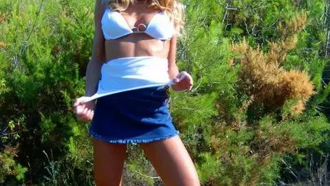 Great teen blonde Suzana doing a hot striptease in the woods  photo 1