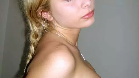 Great little blonde Teresa doing a hot striptease on the bed  photo 10