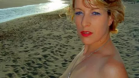 Lovely blonde Tigra getting naked in the rocks  photo 3