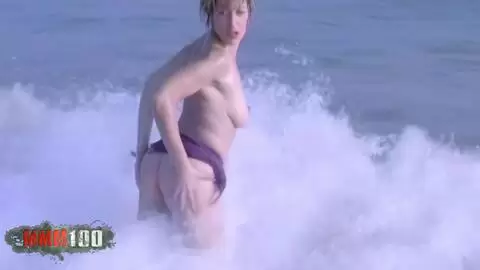 Blonde touching herself by the beach