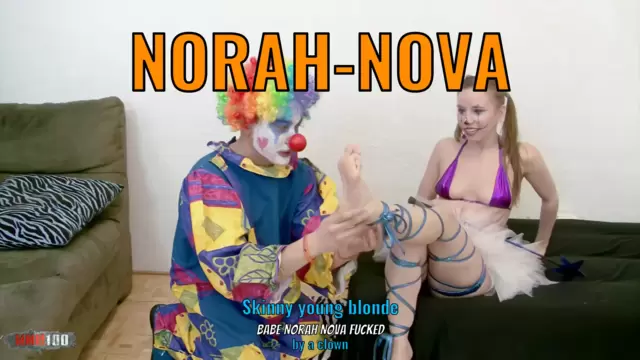 Skinny young blonde babe Norah Nova fucked by a clown